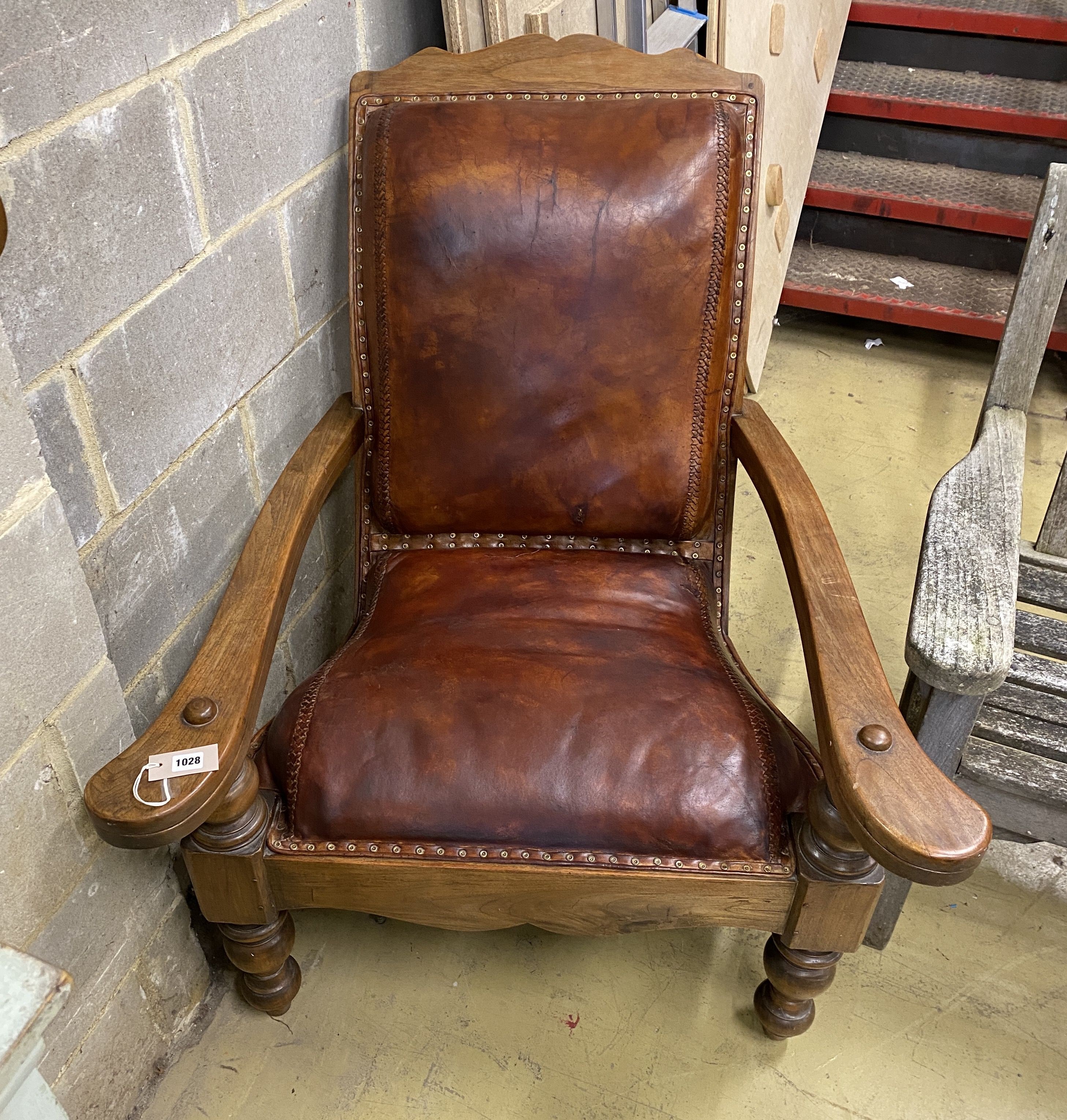 A leather upholstered hardwood plantation chair, width 91cm, depth 94cm, height 106cm
